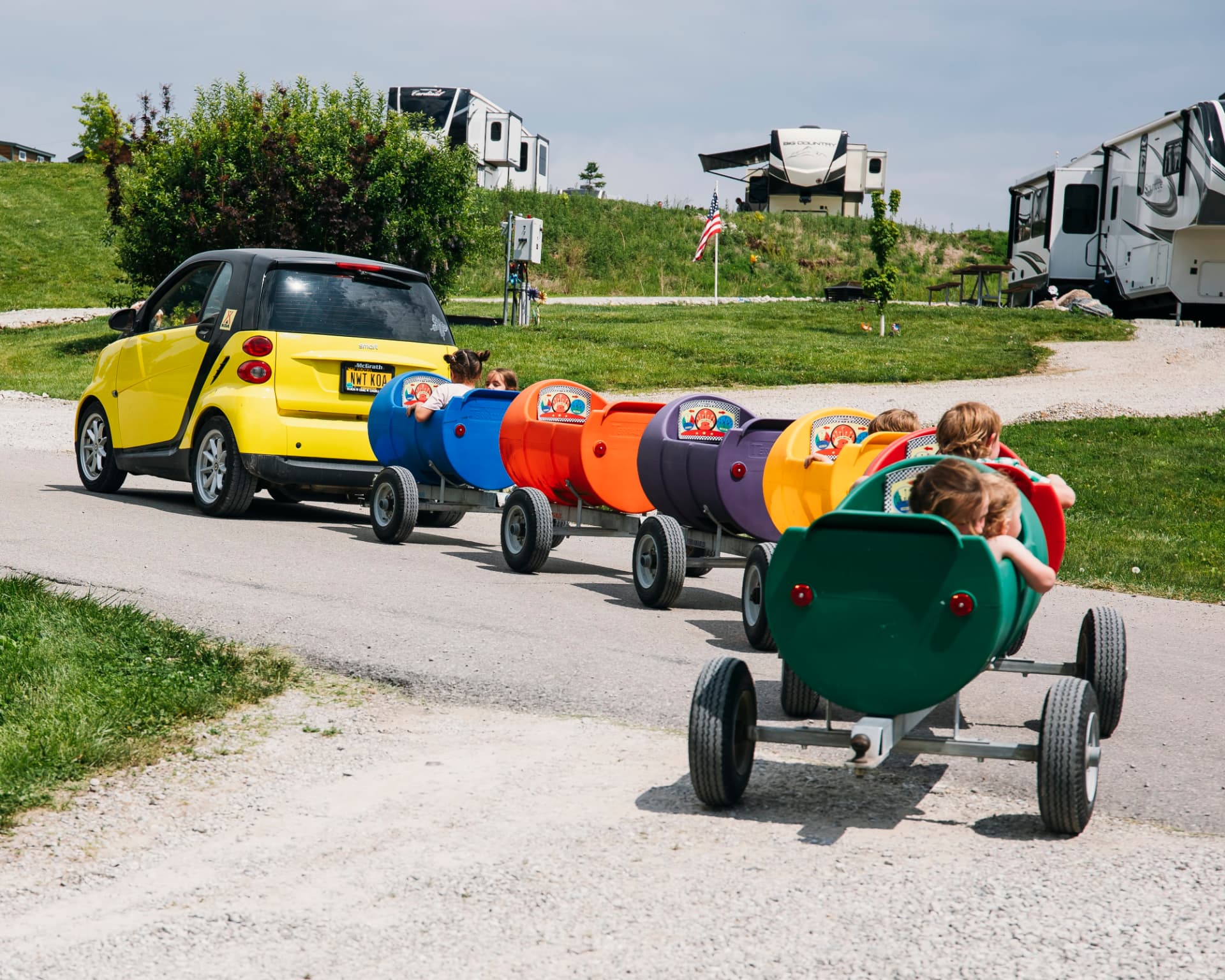 Barrel train ride winding through the campground