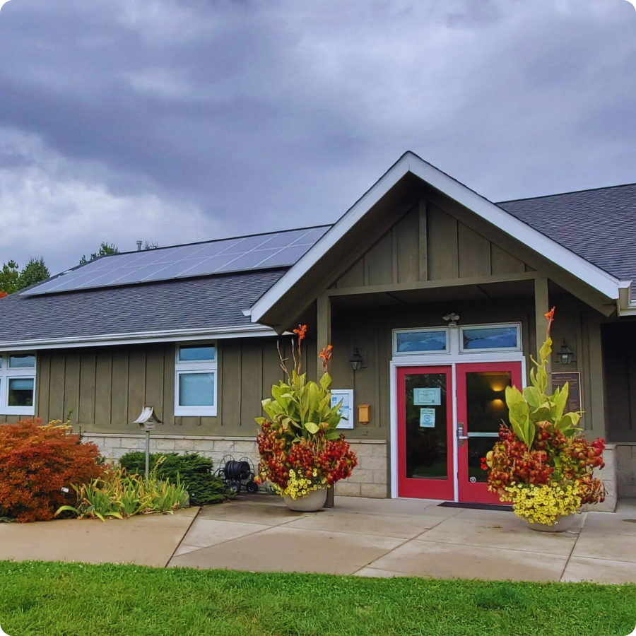 Entrance to Newton Arboretum with colorful seasonal planters