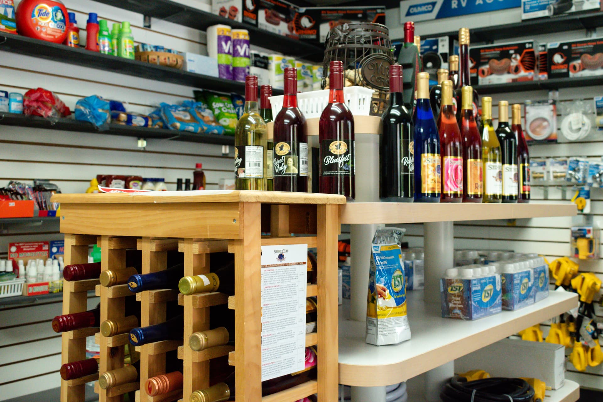 Camp store stocked with essentials, snacks, and local wine