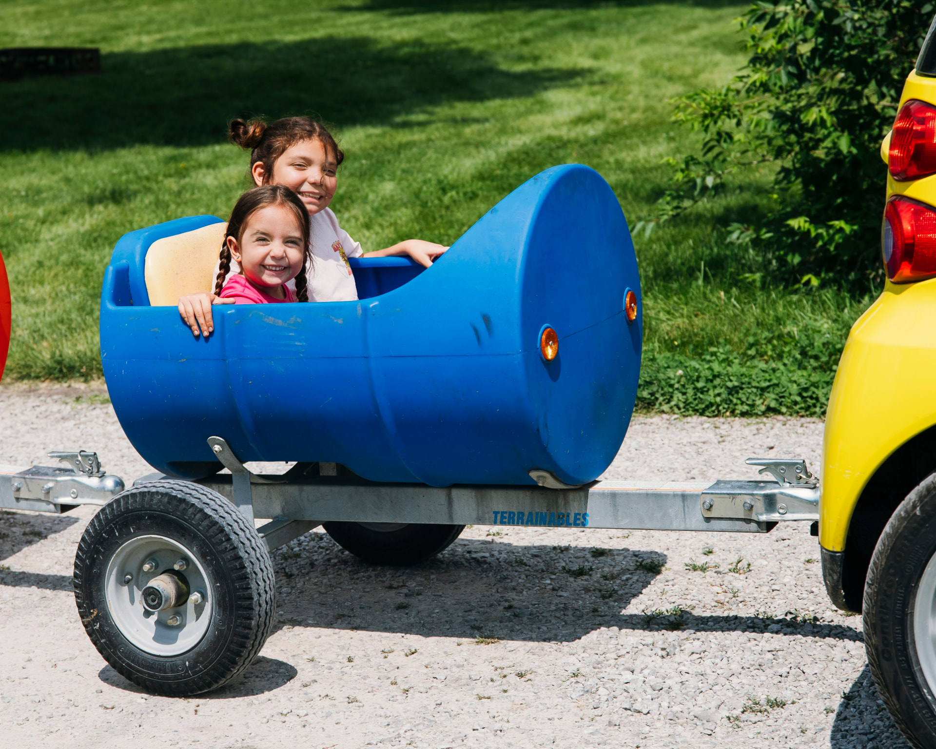 Kids enjoying a ride in the campground barrel train